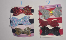 Load image into Gallery viewer, Set of 3 mini bows attached to stretchy nylon headbands
